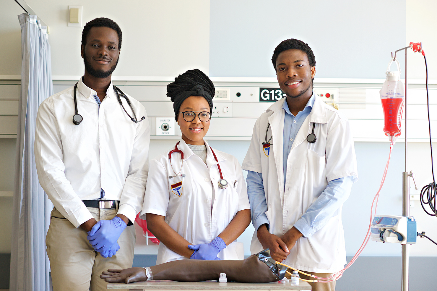 Portrait of Students practising IV injection on a Phlebotomy Venipuncture Practise Arm